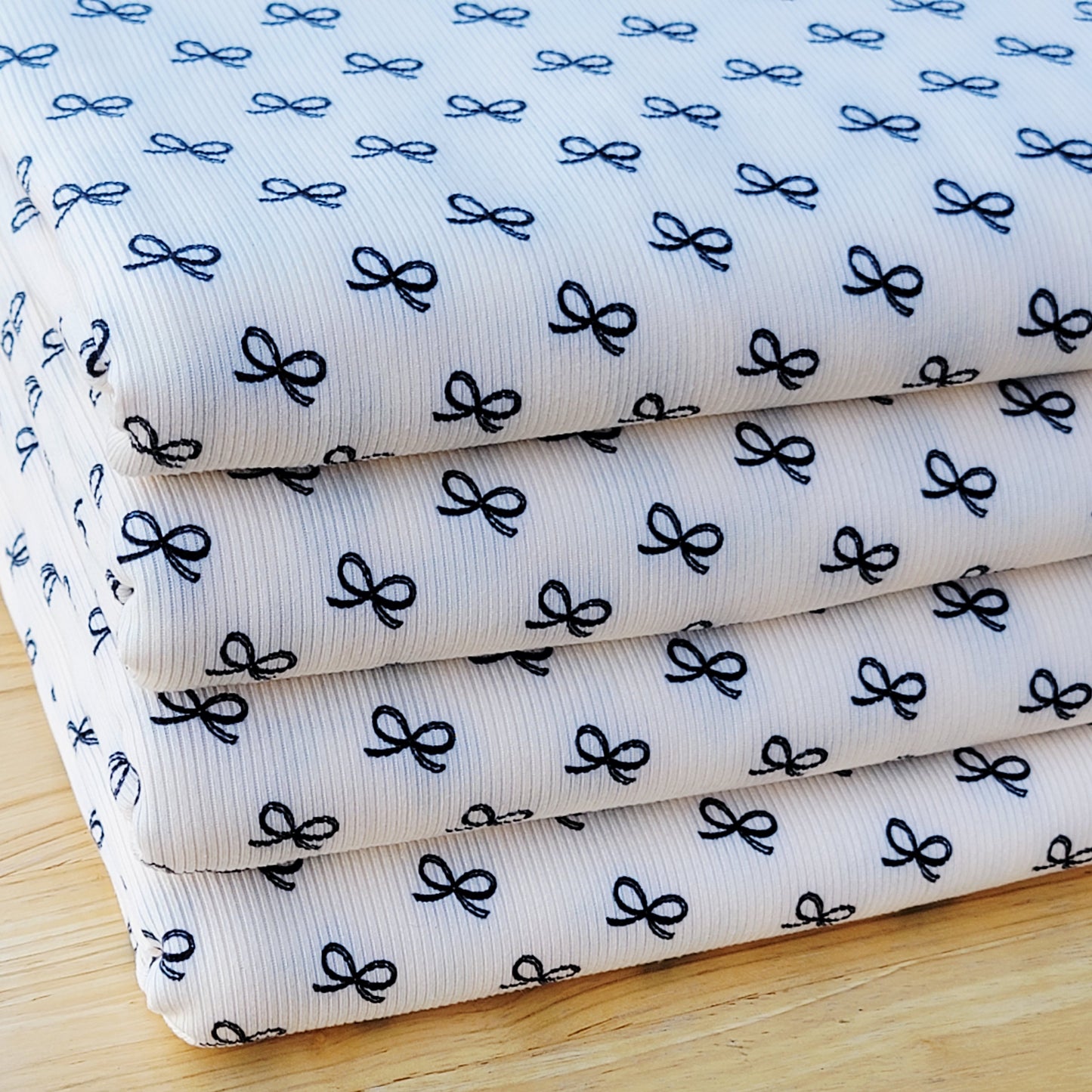 2x2 Yummy Rib Small Black Bows Print